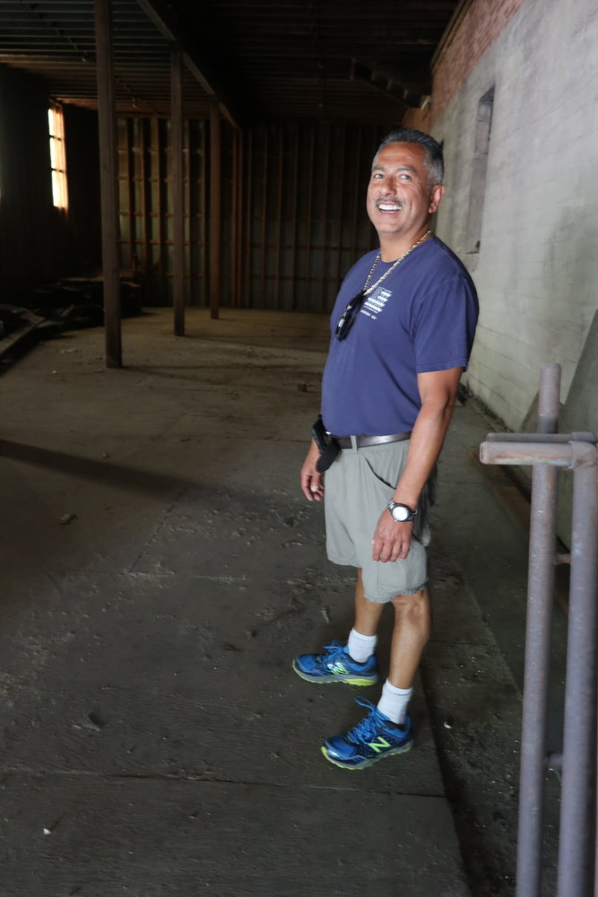 Developer Nick Santana stands in the cavenous basement. "This could be a brewery space," he said.